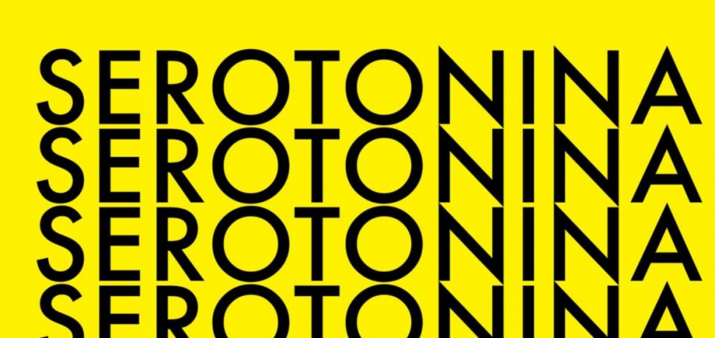 Napis "serotonina" na żółtym tle, powtórzony 4 razy od góry do dołu