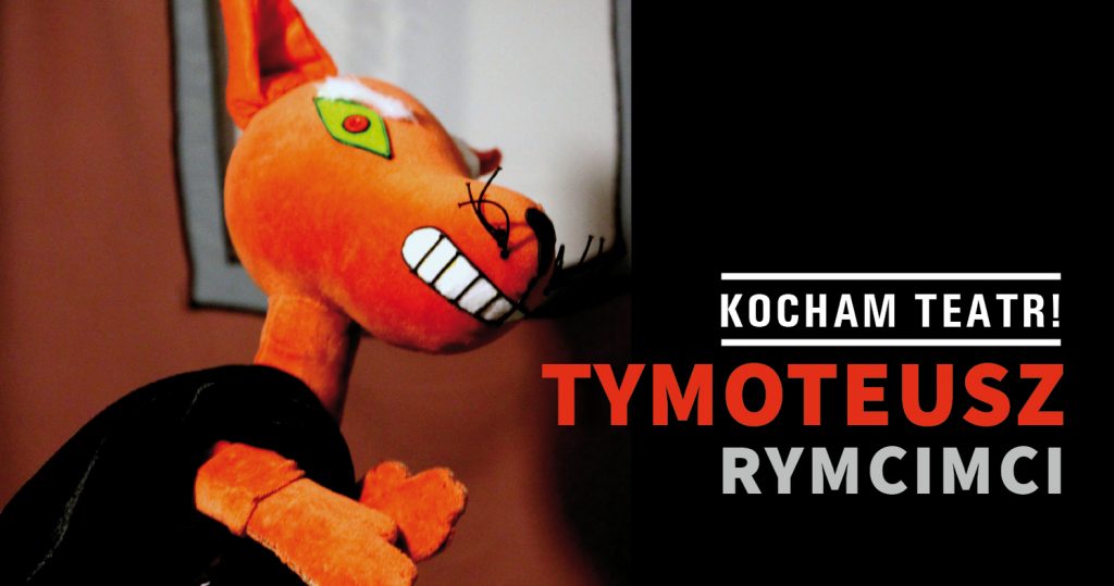 Zdjęcie kukiełki lisa zwróconego bokiem do widza. Po prawej stronie napis: Kocham teatr! Tymoteusz Rymcimci